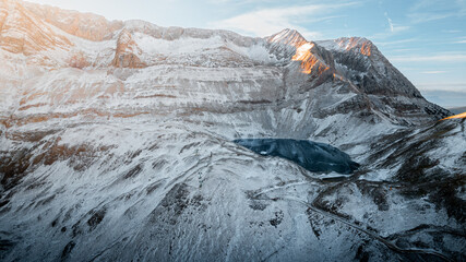 Aerial View of the Ibón de los Asnos in Panticosa, Aragon: Frozen Waters and Snowy Landscape in...