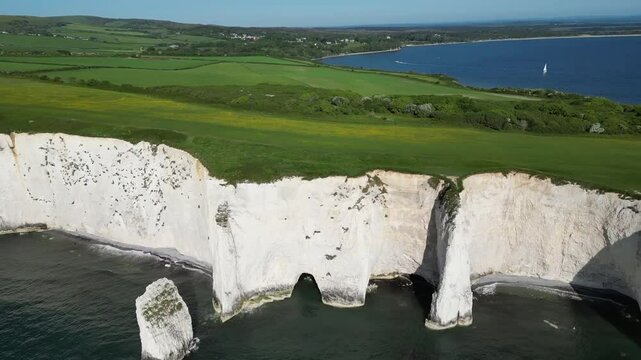 Aerial view of Studland Old Harry cliffs with beautiful coastline and tranquil sea, Dorset, United Kingdom.