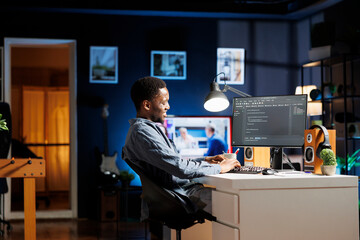 System administrator coding IT script for cloud computing, working on software development with computer language. Technician specialist typing binary code on html terminal window.
