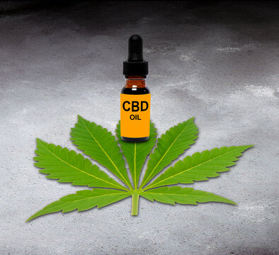 CBD oil and cannabis leaf, composite image