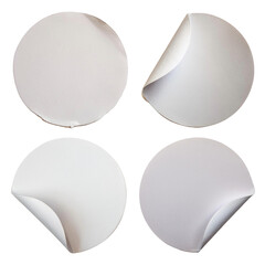 Collection of blank white round torn paper sticker labels isolated on a clean white background, perfect for branding and design concepts