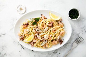 Spaghetti with seafood, parsley and lemon