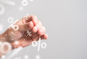 The hand sprinkles a pinch of interest. High interest rates on deposits, great deals on sales and...