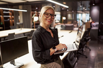 A Professional Woman is Actively Working in a Modern and Stylish Office Environment