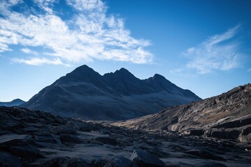 The mountains are covered in snow and the sky is clear