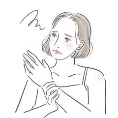 手を見て悩んでいる顔をしている若い女性の上半身