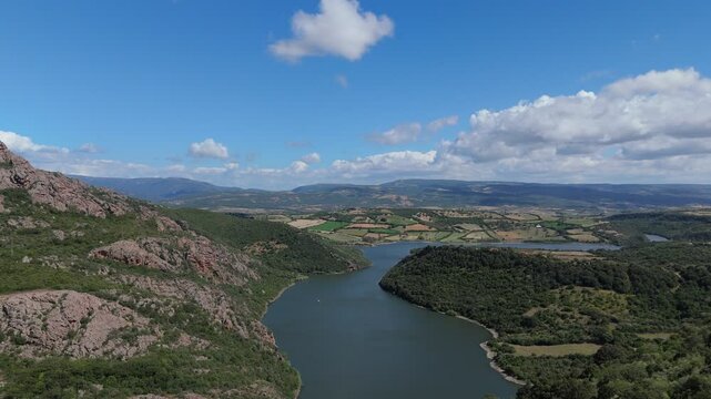 Drone fly above beautiful sardinian landscape with river and mountains.