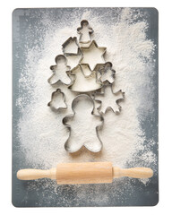 Gingerbread cookie cutters laid out in shape of Christmas tree isolated on white. Top view. Merry Christmas and Happy New Year.