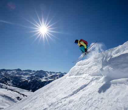 Woman enjoying high-speed ski jump under the bright sun - Powered by Adobe