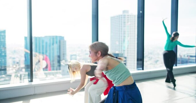 Asian women, dancer and studio with teacher for choreography, lesson or training in city. Japanese, female people or performers with trainer for dancing class, kpop or movement techniques in Japan