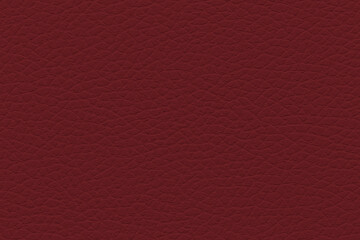 Fototapeta premium Textured close-up of raspberry-coloured leather surface with an intricate pattern