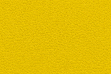 Naklejka premium Close-up of vibrant yellow textured leather surface, smooth finish