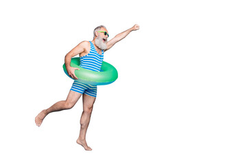 Full body profile side photo of retired pensioner raise his hand running holding green toy ring...