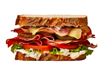 A delicious towering sandwich with meats, cheeses, and fresh vegetables on rye bread.