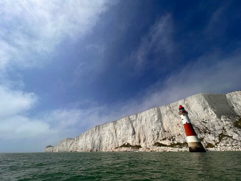 lighthouse in front of white clifs