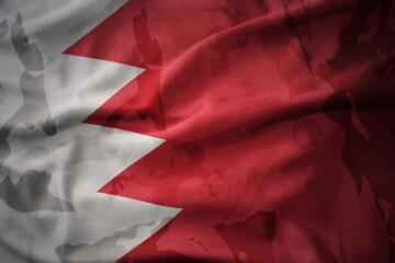 colourful waving flag of bahrain on the old army khaki texture background. military concept.