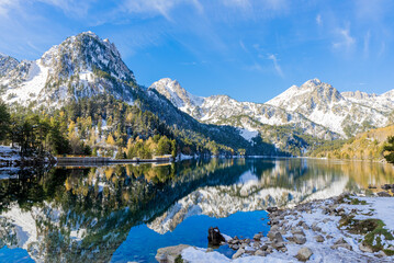 The snowy lake of Sant Maurici in the Aiguestortes National Park in the Pyrenees of Catalonia, Spain