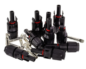 Close up of MC4 connectors designed for solar panel wiring featuring black casings and metal pins...