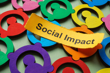 Colorful figures and the phrase social impact. Diversity and community development.