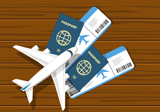 Airline tickets, travel documents, and a miniature airplane on a desk