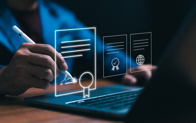 Concept of digital contract innovation. A person uses a stylus to sign a digital document displayed...