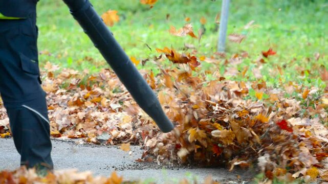 Blowing leaves with a special device, slow motion