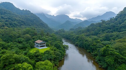 Fototapeta premium Serene river landscape with house amidst lush mountains nature photography aerial view tranquility