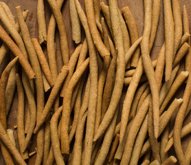 Top view of fried corn stick snack on a wood board, Overhead view of nigerian kokoro corn snack