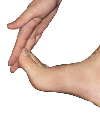 Muslim man performing mas-h on his foot