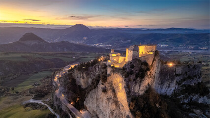 Italy November 24, 2024: aerial view of the village of San Leo with its fortress at sunset. We are in Emilia Romagna in the province of Rimini
