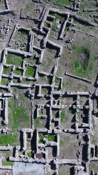 Overhead view of Ugarit ruins or Ras Shamra Syria ancient archeological site, vertical video.
