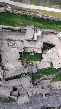 Roof of Krak des Chevaliers castle in Homs Syria overhead drone shot, vertical video.