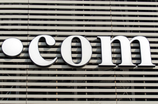 The iconic dot com Internet domain placed on a large retail store facade