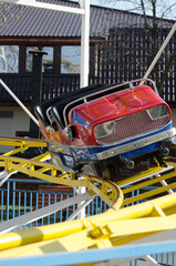 An empty roller coaster car in an amusement park, Bucharest, Romania