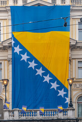 Bosnian flag around  Eternal flame for  Statehood Day