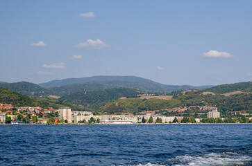 Fototapeta premium Orsova city, Romania, on the shores of Danube river seen from a sightseeing river boat