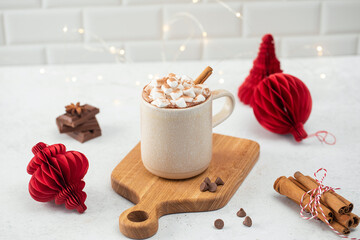 Delicious cocoa cup with whipped cream on wooden board