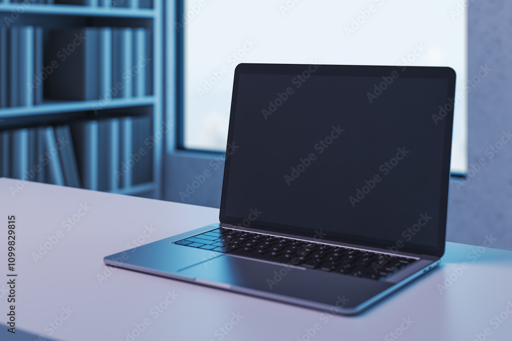 Aufkleber Perspective view on blank dark modern laptop screen with copyspace for your text or logo on empty light grey table on blurred bookcase and window background. 3D rendering, mock up