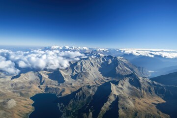 The sky is blue and the mountains are covered in snow