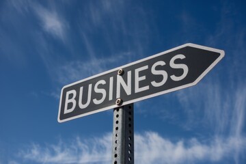 Obraz premium Business word written on a signboard, business and work career concept.