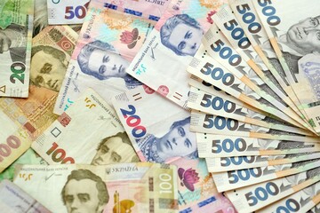 Obraz premium Big amount of different ukrainian hryvnia currency money bills in pile