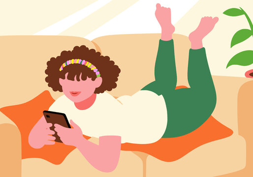 Girl using phone and lying on sofa at home
