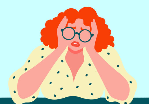 Frustrated woman sitting with head in hands against turquoise background