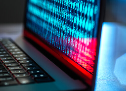Laptop with binary codes on screen