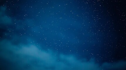 Obraz premium Dark blue night sky with clouds and stars.