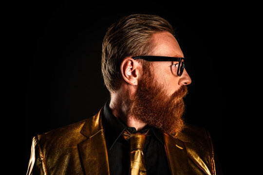 Photo of handsome luxurious rich man with groomed red beard isolated on dark color background - Powered by Adobe