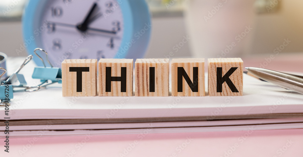 Fototapete wooden cube blocks with think text on table background. business concept