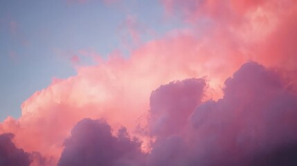 Fototapeta premium Pink and purple sunset clouds fill the frame.