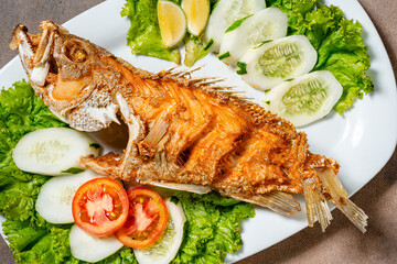 Deep fried crispy grouper fish with sambal dabu dabu