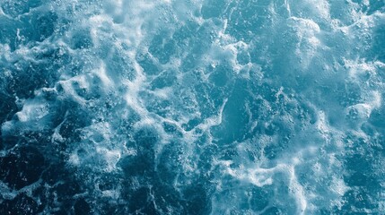 Fototapeta premium Turbulent Ocean Waves Creating Foamy Textures on Blue Water Surface